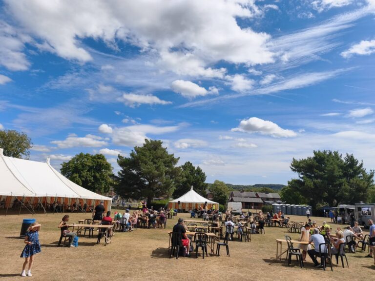 Photo of Party in the Park showing the stalls and people visiting them